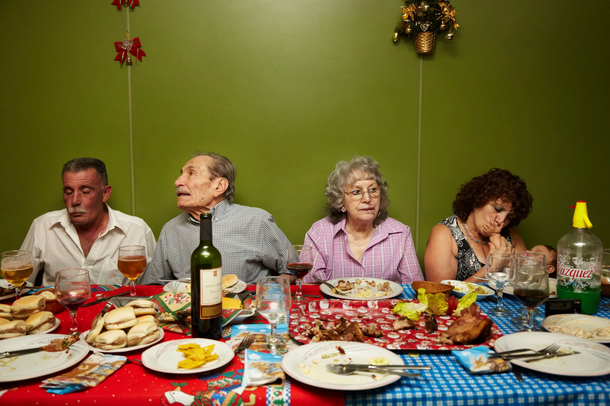 Family members seated around the Christmas Eve dinner table after a meal, The Flowers Family documentary series, Argentina